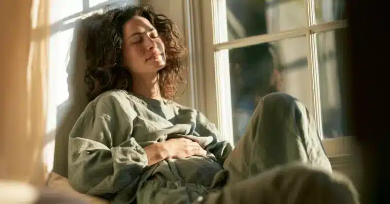 Woman experiencing calm wellness moment related to estrogen dominance symptoms